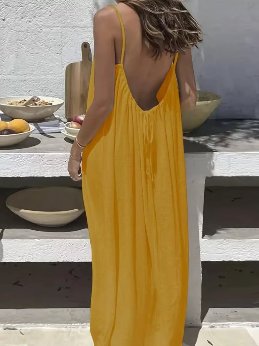 Backless Spaghetti Strap Maxi Dress ~ Flowy comfort with a striking silhouette.