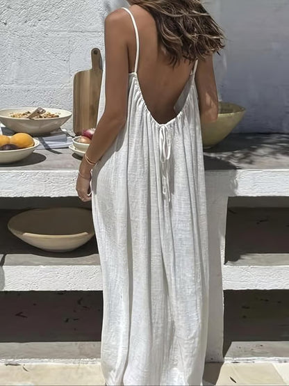 Backless Spaghetti Strap Maxi Dress ~ Flowy comfort with a striking silhouette.
