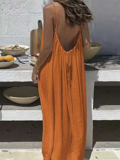 Backless Spaghetti Strap Maxi Dress ~ Flowy comfort with a striking silhouette.